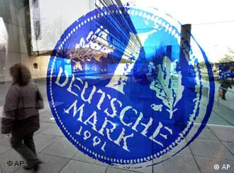 A picture of a deutsche mark coin on a window