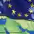 An EU flag above a map of the Middle East