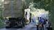 Polisi memblokir jalan ke dan dari kawasan peternakan yang terinfeksi. Polisi memblokir jalan ke dan dari kawasan peternakan yang terinfeksi.