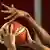 Hands blocking a basketball shot