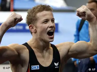 German Fabian Hambuechen celebrates after winning the gold medal in the horizontal bar final at the Gymnastics World Championships in Stuttgart, southern Germany, Sunday, Sept. 9, 2007. (AP Photo/Michael Probst)