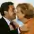 Merkel i Sarkozy se pozdravljaju zagrljajem i poljupcima u obraz