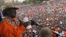 An Orange Democratic Movement (ODM) official Musalia Mudavadi addresses the crowd at Uhuru Park in Nairobi, Kenya, Saturday, Oct. 6, 2007, to launch the campaign for the forthcoming General Election. Tens of thousands of cheering, whistling Kenyans converged on the capital for the launch of the biggest opposition party's electoral campaign. December's polls will mark the first time that an incumbent Kenyan leader has faced a credible opponent since the country's independence in 1963. (AP Photo/Khalil Senosi)