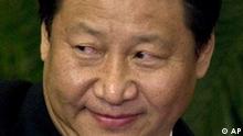Xi Jinping, Shanghai Party Secretary, reacts as he is introduced to the media as part of the new Politburo Standing Committee, in Beijing's Great Hall of the People Monday Oct. 22, 2007. (AP Photo/Ng Han Guan)