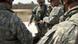 US soldiers standing in half circle around a map in Iraq US soldiers standing in half circle around a map in Iraq