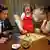 Scene from TV film depicting thalidomide victim playing board game with parents