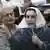 Opposition leader Benazir Bhutto speaks to media outside her home in Islamabad