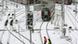 Railway workers walk through snow and past idle commuter trains at the central station in Munich Railway workers walk through snow and past idle commuter trains at the central station in Munich