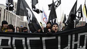 members of the National Bolshevik party marching with black flags and banners