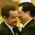 Sarkozy embraces Chinese President Hu Jintao