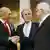 Ehud Olmert and Mahmoud Abbas shake hands as George W. Bush looks on