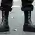 Man with black combat boots