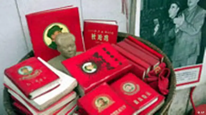A black and white photograph of Mao Tse-tung, founder of the People's Republic of China, in photo at right, and Lin Piao, Chinese Communist general and political leader, in photo at left, and antiquated Red Books from the Cultural Revolution are placed at a local antique stall Tuesday, May 25, 1999 in a back alley in Shanghai. Mao goods are one of the most wanted Chinese souvenirs among tourists from the U.S. According to local travel agencies majorities of tour reservations from the U.S. and Europe have been canceled after NATO's missile attack on the Chinese embassy in Yugoslavia. On May 28th Shanghai will celebrate its 50th Anniversary of the Arrival of the Communist Army in Shanghai led by Mao. (AP Photo/Eugene Hoshiko)