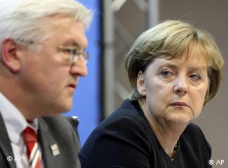 Merkel y su ministro de Exteriores, Steinmeier.