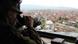 Bundeswehr soldier looks down on Kosovo Bundeswehr soldier looks down on Kosovo