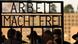 Members of Germany's Sinti and Roma communities pass through the gate bearing the words 'Arbeit macht frei' at a former concentration camp near Berlin Members of Germany's Sinti and Roma communities pass through the gate bearing the words 'Arbeit macht frei' at a former concentration camp near Berlin