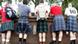 Men in kilts from the back Men in kilts from the back