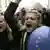 A girl carrying an EU baloon shouts slogans during a protest rally in Belgrade