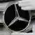 Mercedes brand (star) being polised