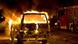 Firemen working under police protection as they tackle the fire in a burning car which was set on fire in Copenhagen on Feb. 15, 2008 Firemen working under police protection as they tackle the fire in a burning car which was set on fire in Copenhagen on Feb. 15, 2008