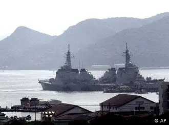 Japanese Maritime Self-Defense Force's Aegis-class destroyer Kongo, left, and another vessel are anchored at Sasebo naval base, Japan, Wednesday, Sept. 26, 2001. Legislation authorizing Japan's military to support the U.S.-led war on terror won final approval Monday, Oct. 29, 2001, paving the way for Japan to send non-combat troops overseas. The Sasebo base in southern Japan has become the likely launching point for whatever Japan's first step might be.