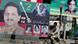 A cyclist rides past a billboard showing a portrait of slain opposition leader Benazir Bhutto, center, and former Prime Minister Nawaz Sharif A cyclist rides past a billboard showing a portrait of slain opposition leader Benazir Bhutto, center, and former Prime Minister Nawaz Sharif