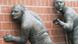 Sculptures of people with their ears pressed against a wall Sculptures of people with their ears pressed against a wall