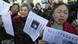 Petitioners chant their grievances outside the Beijing No. 1 People's Intermediate Court in Beijing Thursday, April 3, 2008. Chinese civil rights activist Hu Jia was sentenced at the court to 3 1/2 years in jail on subversion charges Thursday in a decision that drew international criticism ahead of the Beijing Olympic Games. (AP Photo/Greg Baker) Petitioners chant their grievances outside the Beijing No. 1 People's Intermediate Court in Beijing Thursday, April 3, 2008. Chinese civil rights activist Hu Jia was sentenced at the court to 3 1/2 years in jail on subversion charges Thursday in a decision that drew international criticism ahead of the Beijing Olympic Games. (AP Photo/Greg Baker)