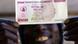 A man holds a 50 million Zimbabwean dollar bill A man holds a 50 million Zimbabwean dollar bill