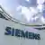 The Siemens company's logo is seen outside an administration building