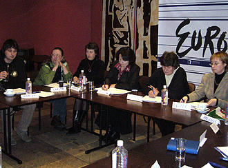 Participants sit at a table