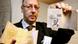 Gerrit Jan Evers holds up documents from the Nazi archive Gerrit Jan Evers holds up documents from the Nazi archive
