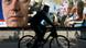 A man on bicycle drives by a pre-election billboards showing Serbia's nationalist prime minister Vojislav Kostunica,left, and pro-western President Boris Tadic with graffiti reading "Tadic, Judas", in downtown Belgrade A man on bicycle drives by a pre-election billboards showing Serbia's nationalist prime minister Vojislav Kostunica,left, and pro-western President Boris Tadic with graffiti reading "Tadic, Judas", in downtown Belgrade