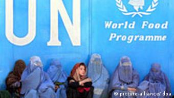 women sitting in front of a UN logo
