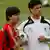 Michael Ballack, right, talks to his coach Joachim Loew, left, during a training session