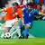 Italy's Gennaro Gattuso, right, challenges Netherlands' Wesley Sneijder