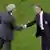 France's head coach Raymond Domenech, left, and Italy's head coach Roberto Donadoni, right, shake hands