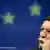 Irish Prime Minister Brian Cowen with European Commission President, Portuguese, Jose Manuel Barroso at podiums drapped with EU flags of yellow stars on royal blue background