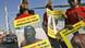 Zimbabweans and South Africans hold signs protesting against election-related violence. Zimbabweans and South Africans hold signs protesting against election-related violence.