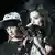 Bill Kaulitz and Tom Kaulitz, brothers who star in Tokio Hotel, playing on stage