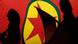 Silhouettes of people imposed on a PKK flag Silhouettes of people imposed on a PKK flag