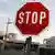 Stop sign in front of nuclear plant