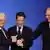 French President Nicolas Sarkozy, center, pulls together the hands of Palestinian President Mahmoud Abbas, left, and Israel's Prime Minister Ehud Olmert