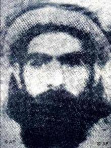 Mullah Mohammed Omar headshot, as Taliban supreme leader, B&W photo on black