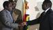 President Robert Mugabe, left shakes the hands of Morgan Tsvangirai, leader of the main opposition leader in Zimbabwe at the signing of a memorandum of understanding between the two parties in Harare President Robert Mugabe, left shakes the hands of Morgan Tsvangirai, leader of the main opposition leader in Zimbabwe at the signing of a memorandum of understanding between the two parties in Harare