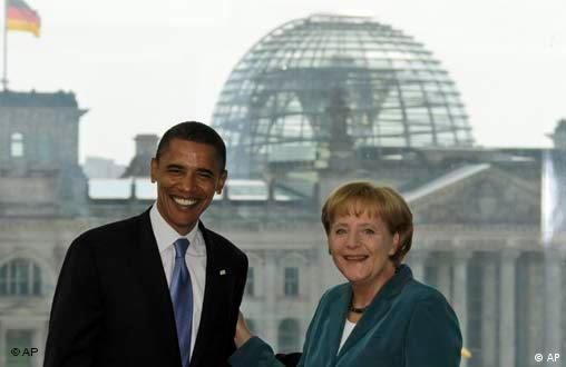 Barack Obama is welcomed by German Chancellor Angela Merkel in the chancellery in Berlin