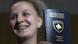 A Kosovo Albanian woman shows her new passport A Kosovo Albanian woman shows her new passport