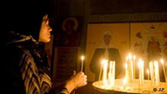 A woman prays at an Orthodox church in central Tskhinvali, in the breakaway Georgian province of South Ossetia