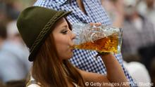Bildergalerie Oktoberfest
27.09.2016+++Vera, a young woman wearing traditional Bavarian dress Dirndl, enjoys a beer under a tent during the Oktoberfest beer festival fair at the Theresienwiese in Munich, southern Germany, on September 27, 2012. The world's biggest beer festival Oktoberfest will run until October 7, 2012. AFP PHOTO / CHRISTOF STACHE (Photo credit should read CHRISTOF STACHE/AFP/GettyImages)
(c) Getty Images/AFP/C. Stache