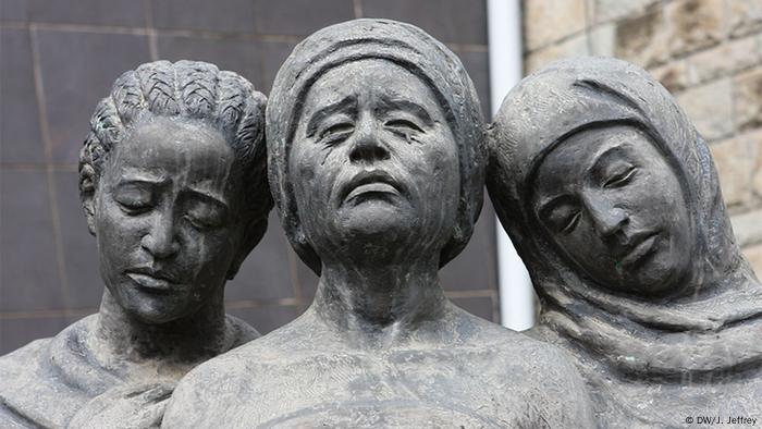 A statue of three grieving women A statue of three grieving women